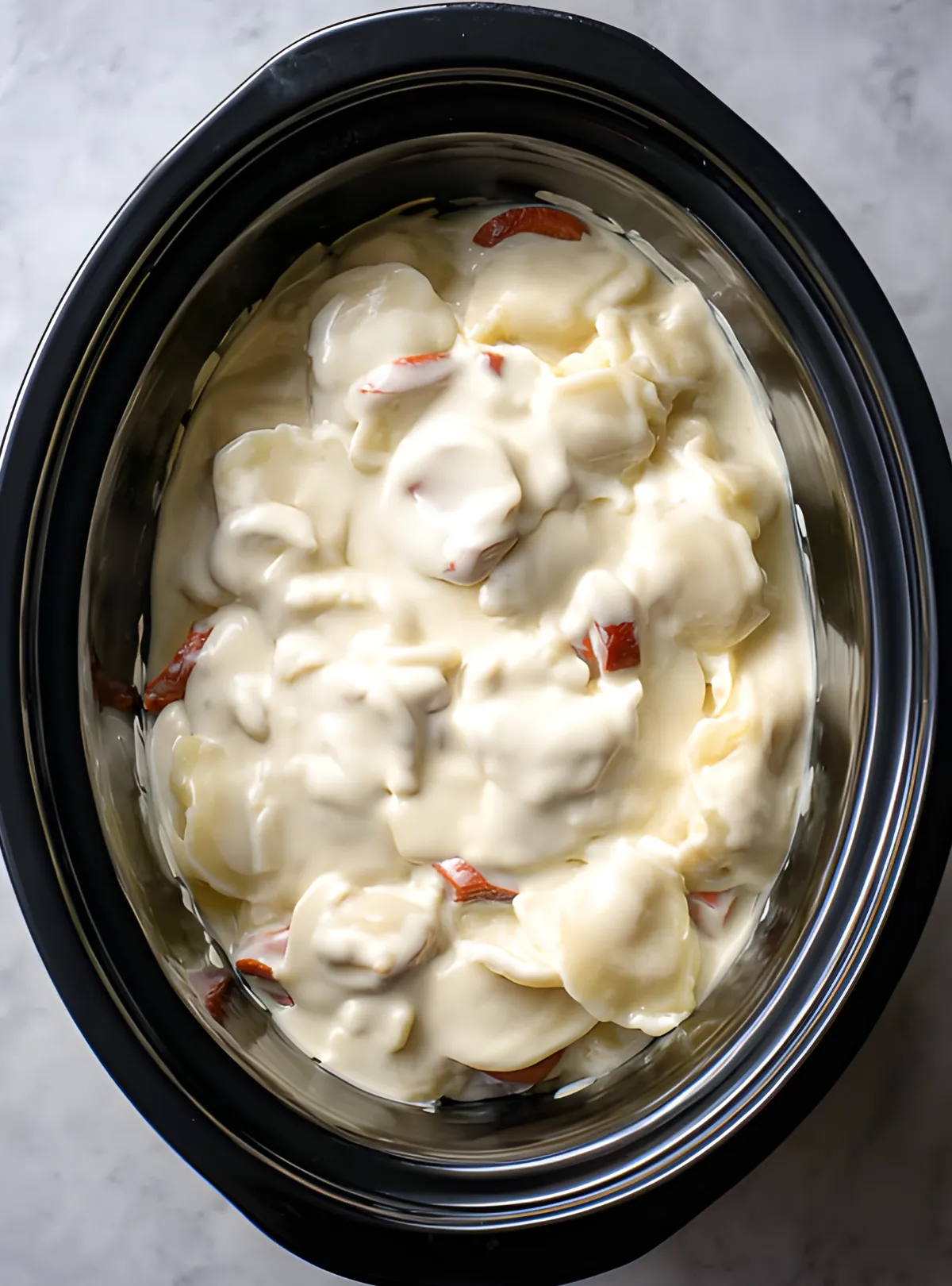 Crockpot pierogi with sauce