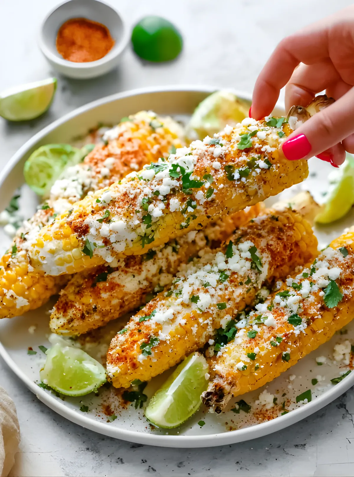 hand holding elote