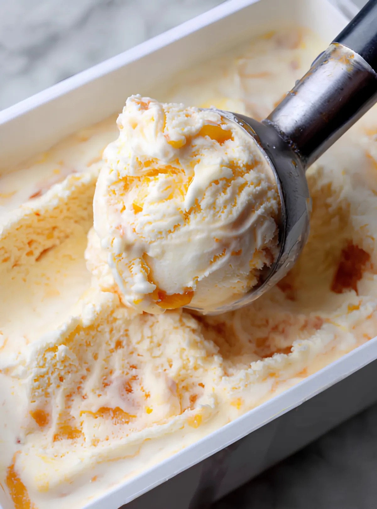 Peach ice cream scoop